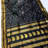 Black saree with golden zari work for Makar Sankranti.
