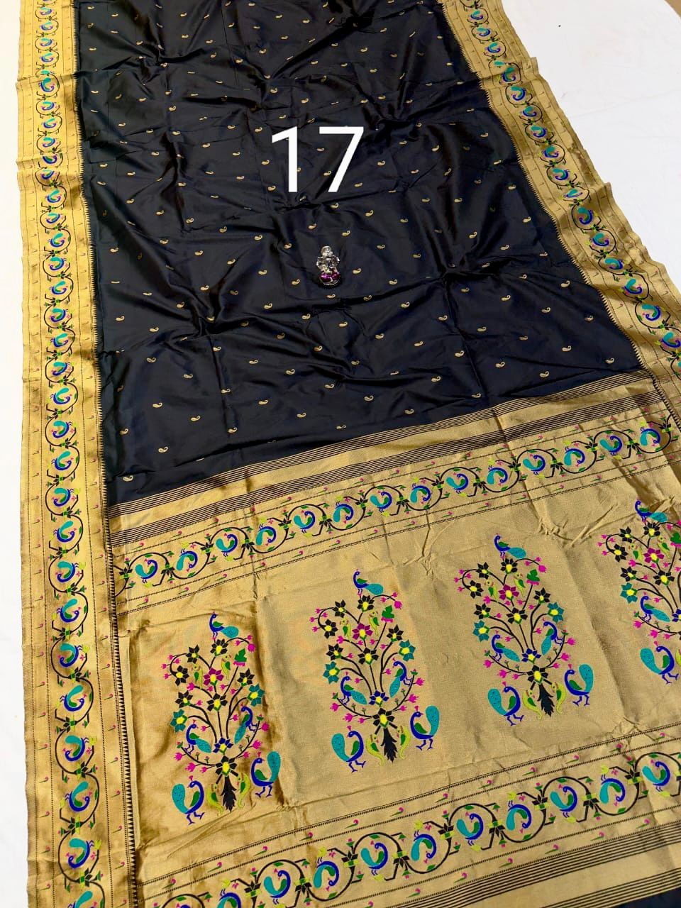 Makar Sankranti special black saree with floral embroidery.