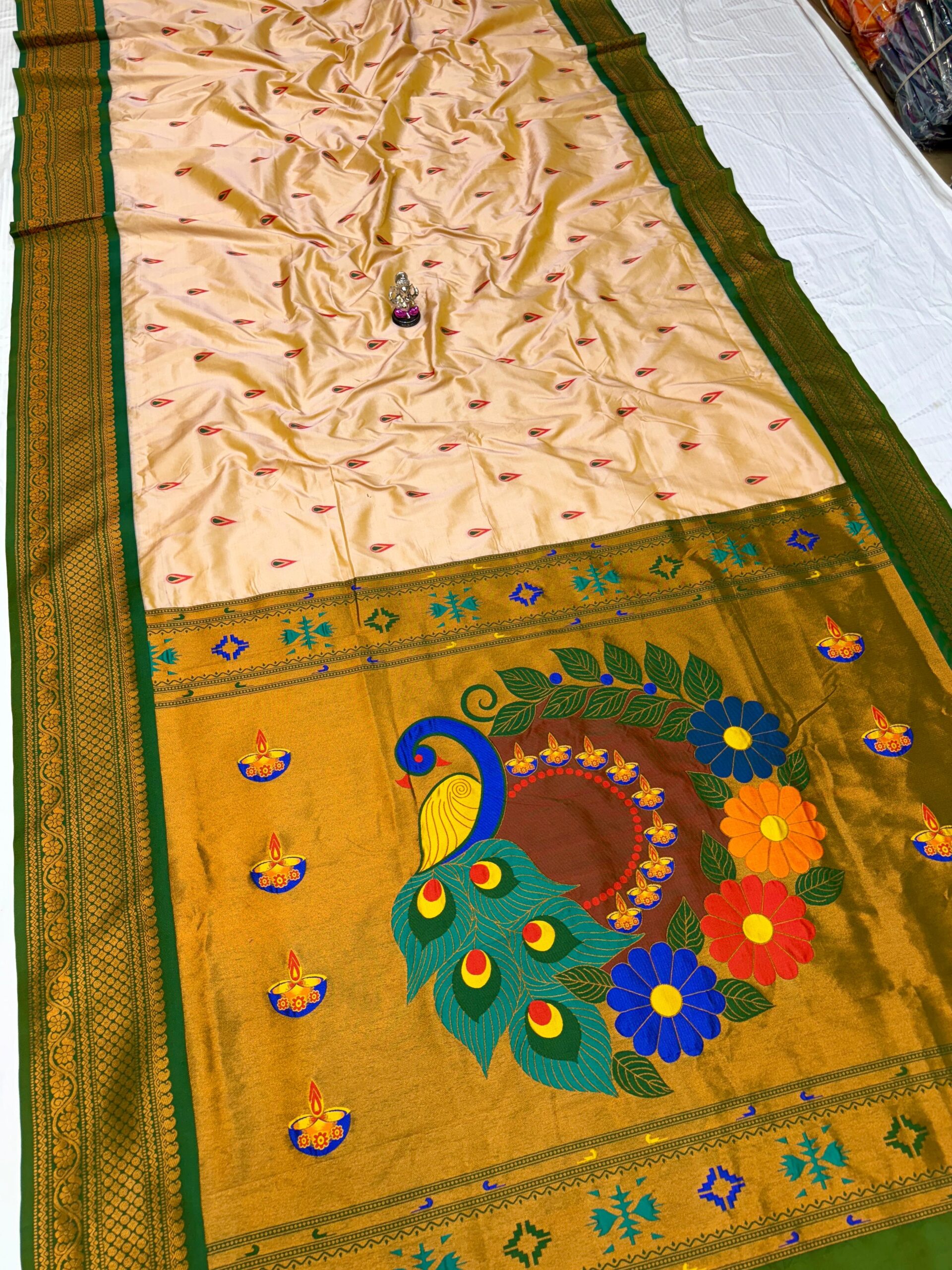 Jyoti Kadiyal Paithani in Premium Katan Silk with floral embroidery.