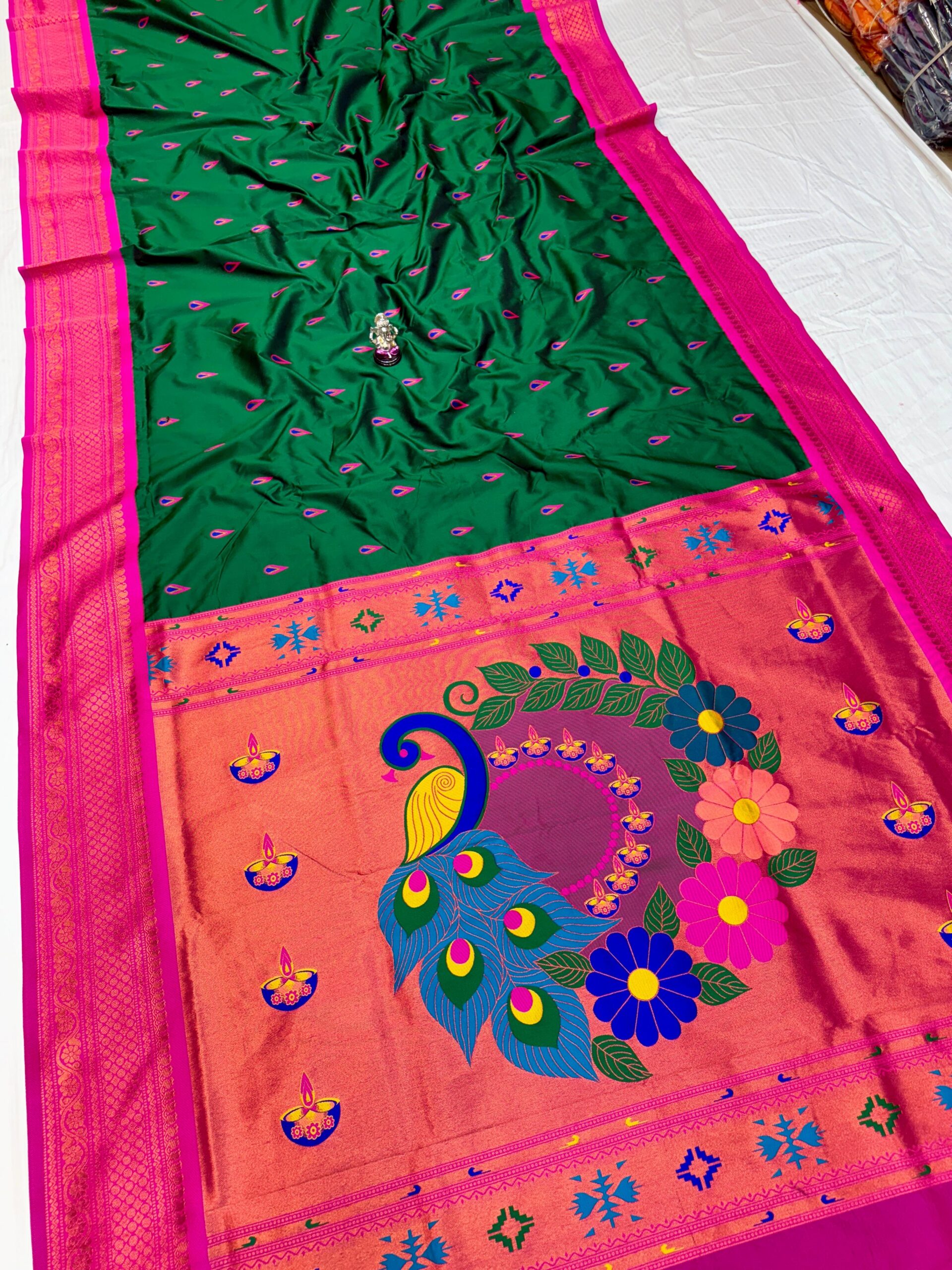 Jyoti Kadiyal Paithani in Premium Katan Silk with floral design.