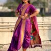 A vibrant purple Nauvari saree with zari work.