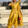 A woman wearing a vibrant yellow Nauvari saree.