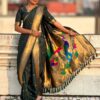 Dark green Nauvari saree with floral design.